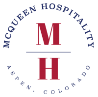 The letters M and H in large red font