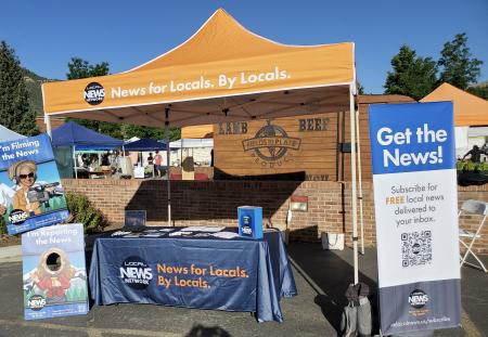 A Local News Network booth at the farmers market in Durango