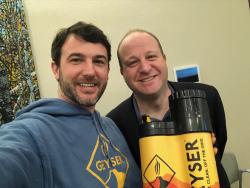 Jonathan Ballesteros, CEO and founder of Geyser Systems, with Colorado's Governor Jared Polis
