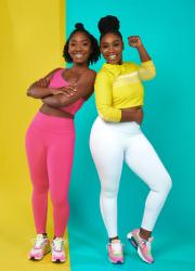 Fit & Nu founding sisters pose in bright pink and yellow workout clothing