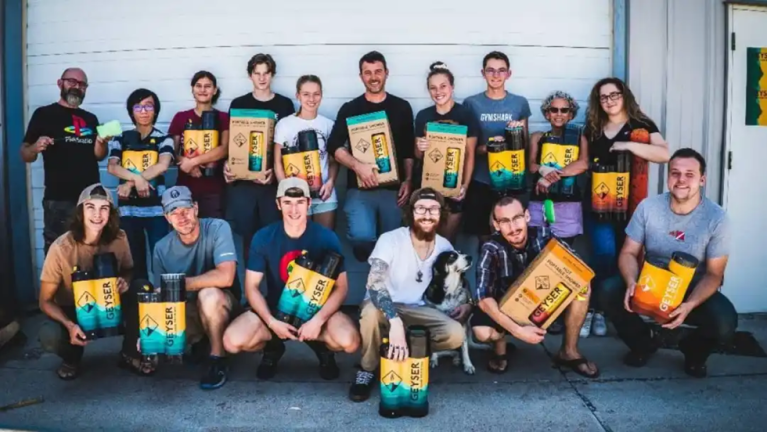 Geyser Systems group photo holding product