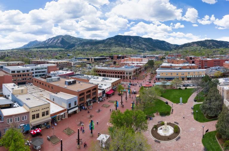 Overhead view of the city of boulder with mountains in the background