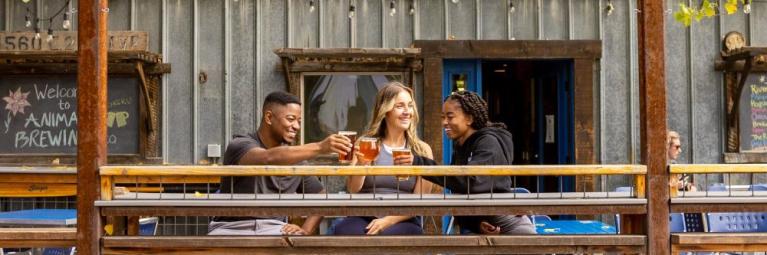 A trio cheers on the Animas Brewing Company patio in Durango.