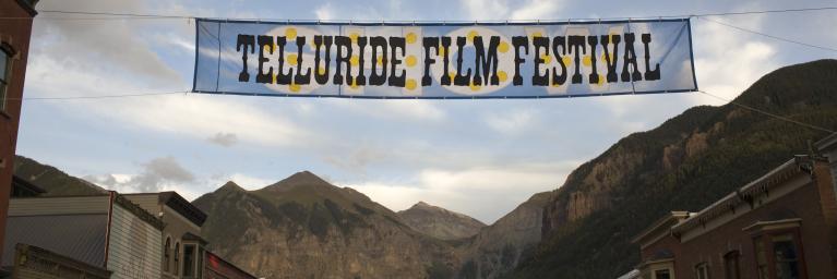 banner saying telluride film festival with mountains in background