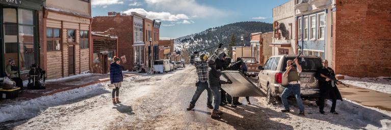 Filmmakers in small town street in Colorado in the winter