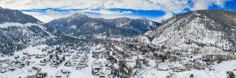 Image of the snow covered valley which Lake City sits in on a sunny winter day.
