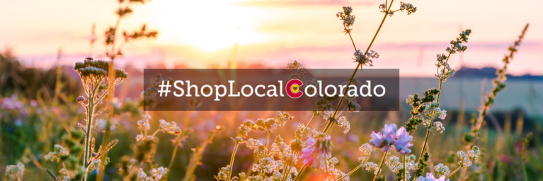 #shoplocalcolorado written over flowers and mountains