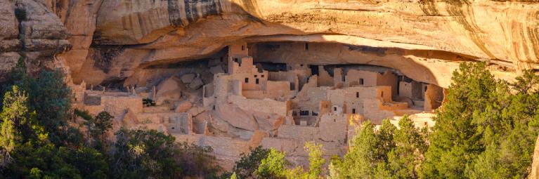 Mesa Verde National Park cliff houses and historic ruins on a sunny day. 