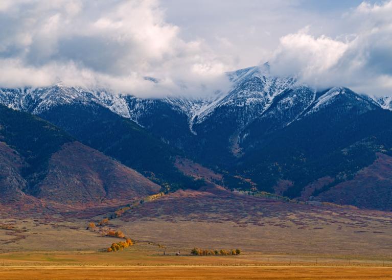 Clouds loom over purple mountains