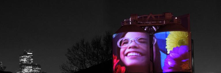 movie projected onto large water tanks