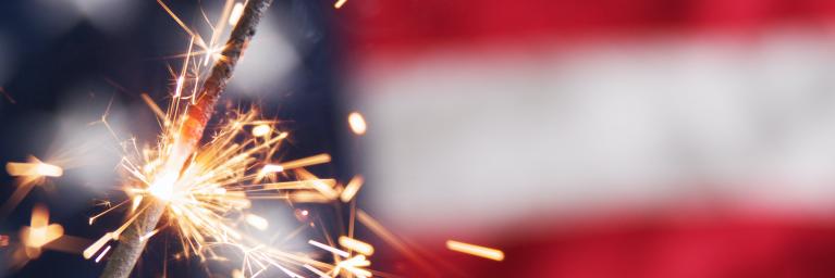 sparkler in front of the United States flag