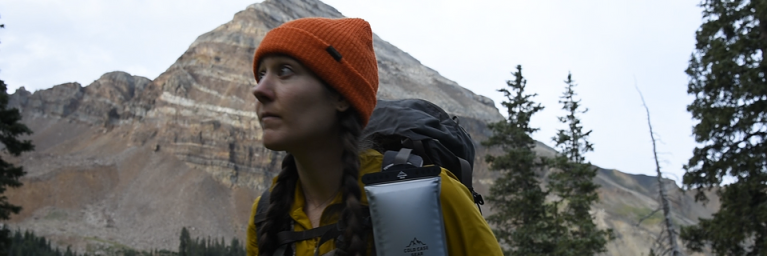 woman hiking with Cold Case Gear in Colorado
