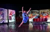 Dancer jumping across stage