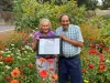 applewood seed founders stand in flowers