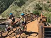 People biking over bridge in Colorado