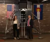 ispace leaders in front of model of lunar technology and american and colorado flags