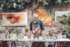 Man artist painting pottery