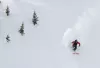 person skiing down a mountain