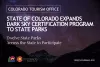 Promotional image from the Colorado Tourism Office announcing the expansion of the Dark Sky Certification program to twelve state parks, featuring a night sky filled with stars over a silhouette of mountains.